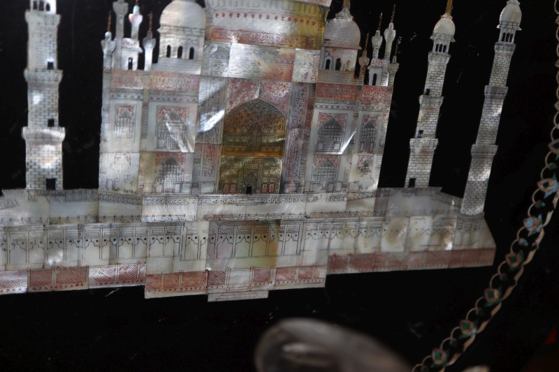 A mother-of-pearl inlaid dish depicting the Taj Mahal with two paintings